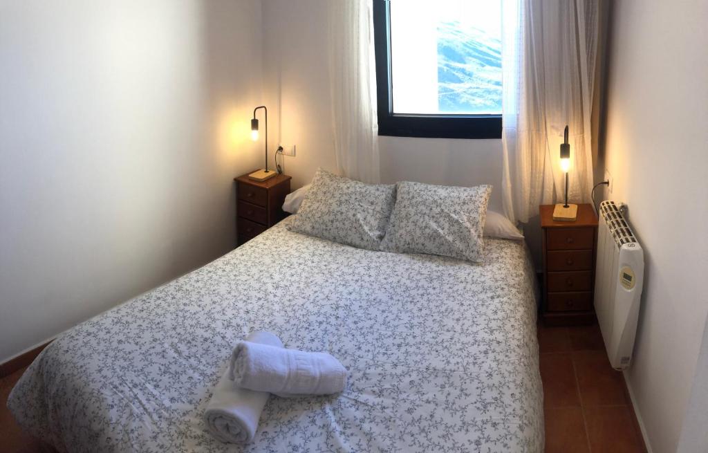 Postel nebo postele na pokoji v ubytování zona media apartamento confort monte oiz