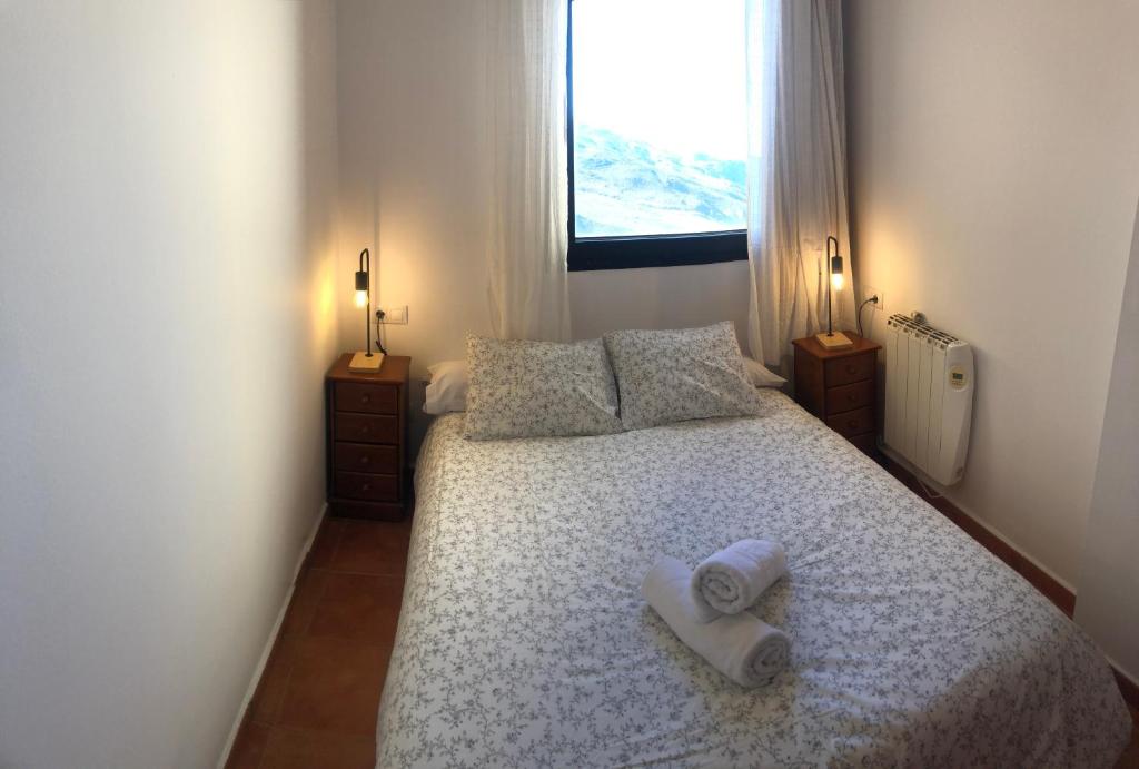 Postel nebo postele na pokoji v ubytování zona media apartamento confort monte oiz