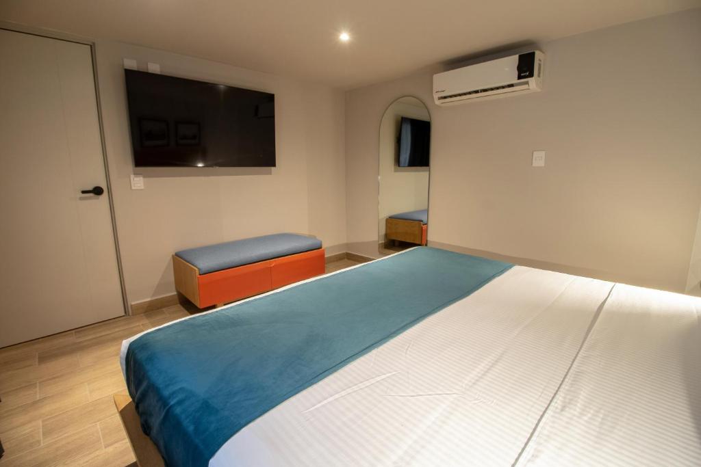 Postel nebo postele na pokoji v ubytování Oliva Plaza Hotel