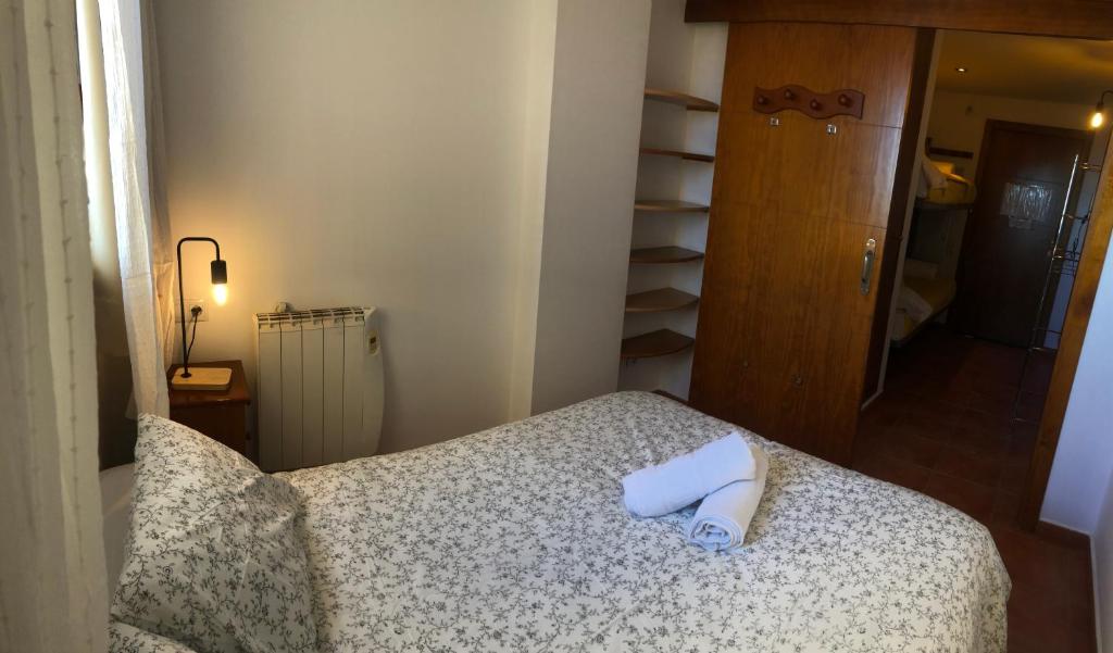 Postel nebo postele na pokoji v ubytování zona media apartamento confort monte oiz