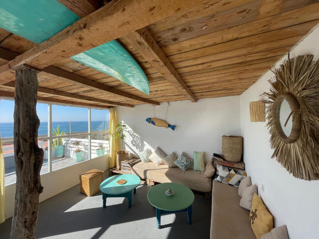 a living room with a view of the ocean at Surf HouseMaroc in Essaouira