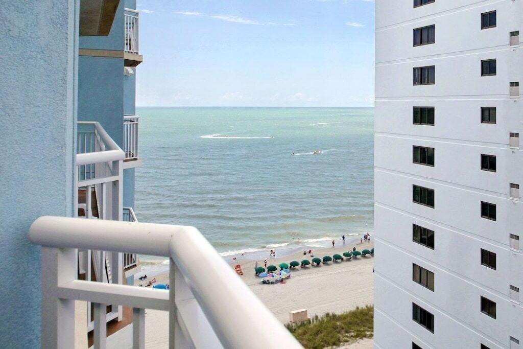 a view of the beach from a balcony of a building at 2501 S Ocean Blvd, 1115 - Ocean View Sleeps 8 in Myrtle Beach