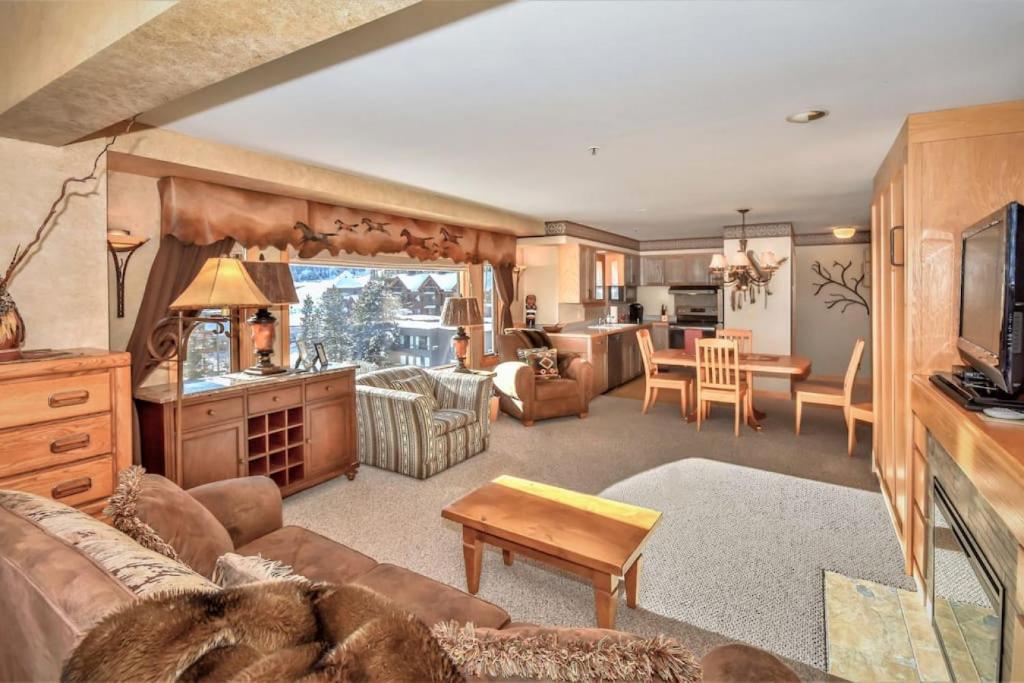 a living room with a couch and a table at Spectacular Views, Pool, Hot Tub, Mountain Village in Big Sky
