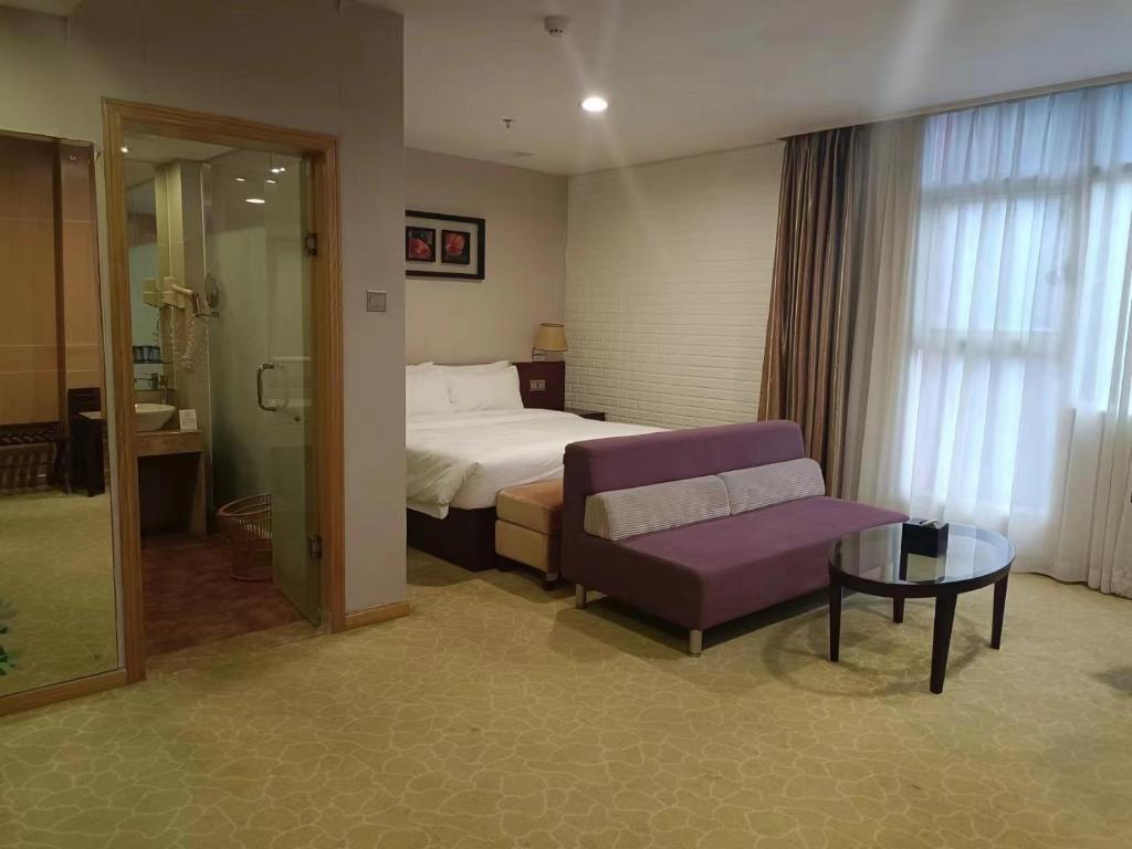 Postel nebo postele na pokoji v ubytování Guangdong Baiyun City Hotel