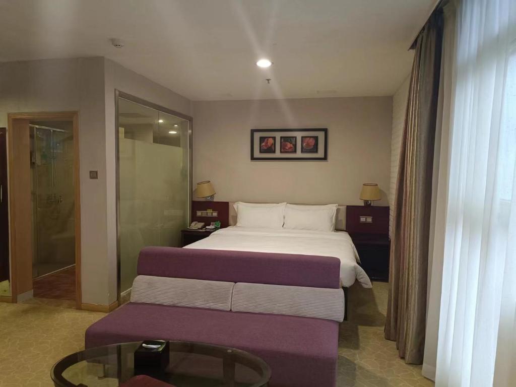 Postel nebo postele na pokoji v ubytování Guangdong Baiyun City Hotel
