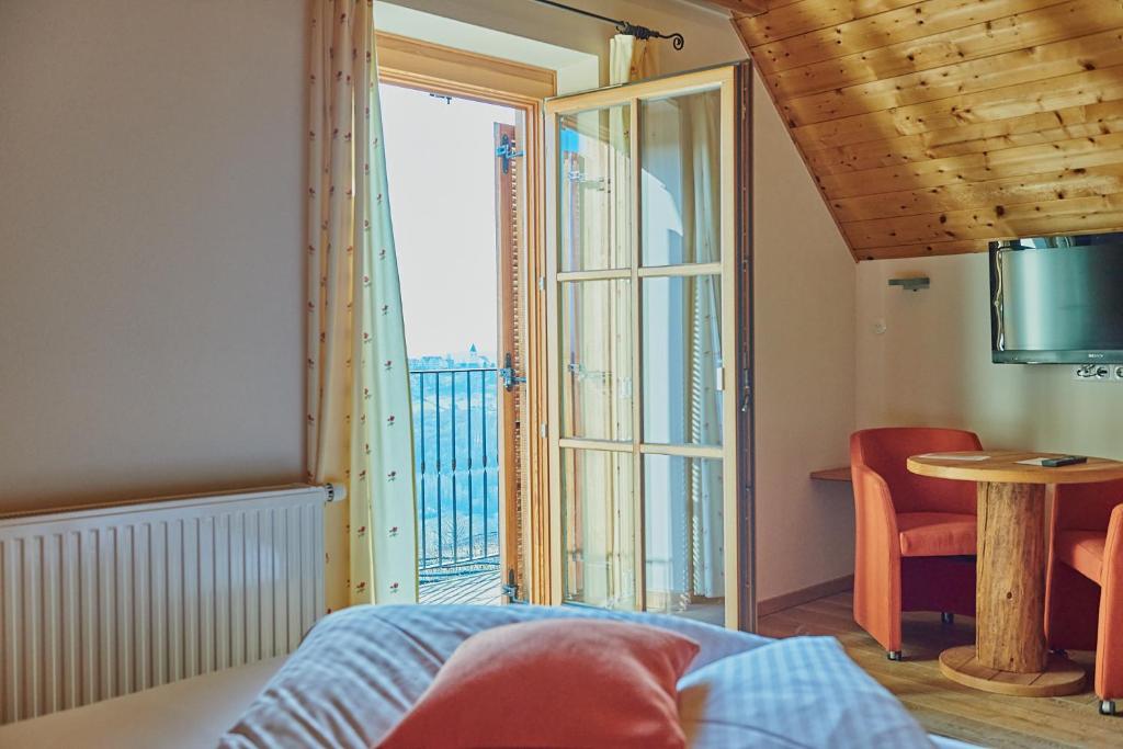 Postel nebo postele na pokoji v ubytování Winzerzimmer Scharl