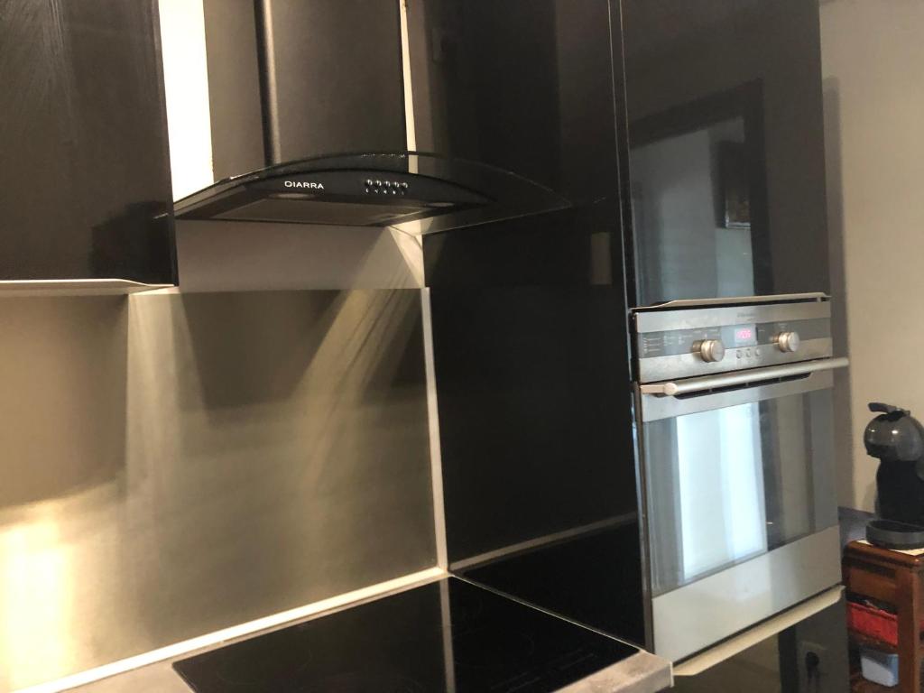 Kuchyň nebo kuchyňský kout v ubytování Beauvais chambre 1