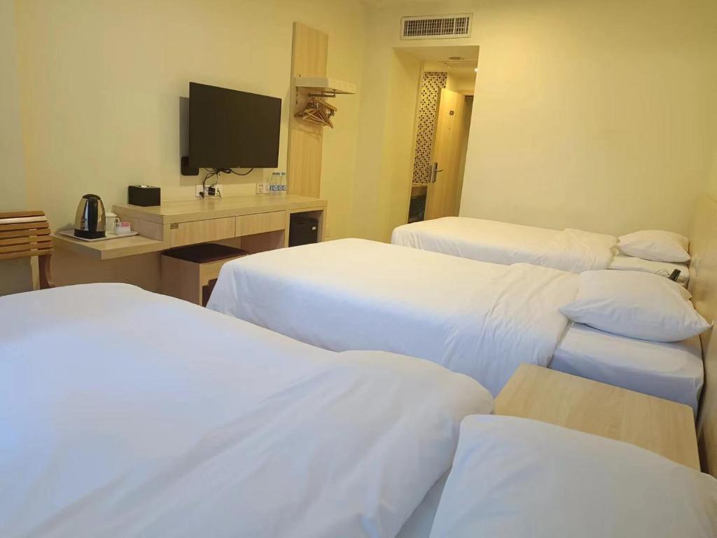 TV a/nebo společenská místnost v ubytování Guangdong Baiyun City Hotel