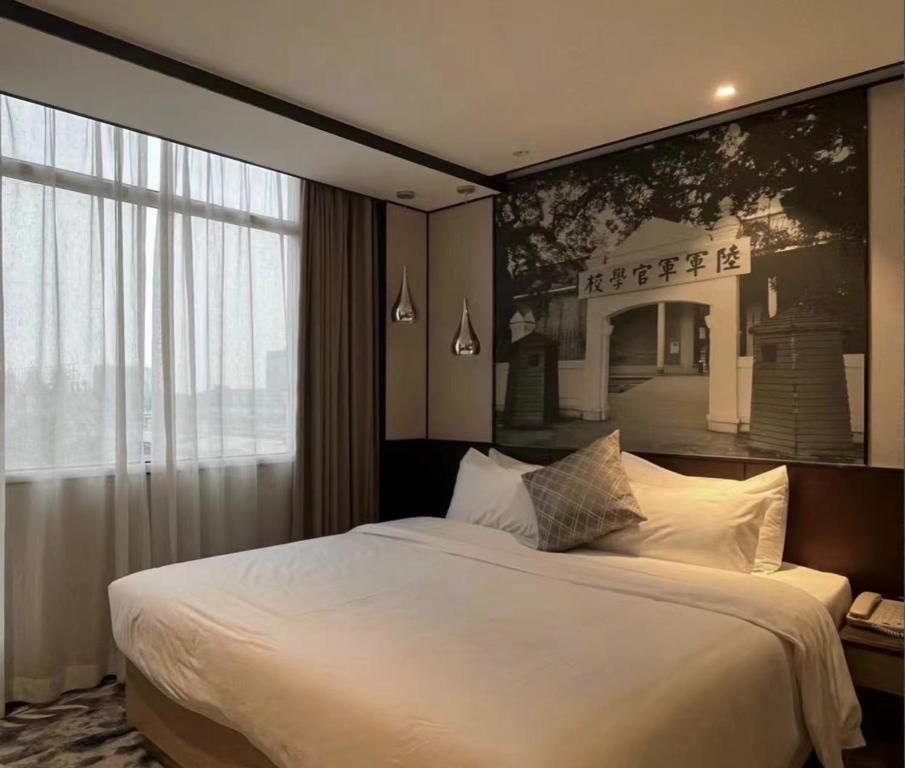 Postel nebo postele na pokoji v ubytování Guangdong Baiyun City Hotel