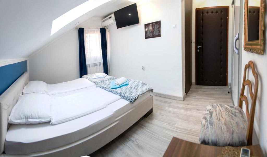 Voodi või voodid majutusasutuse Guest House Ćiro toas