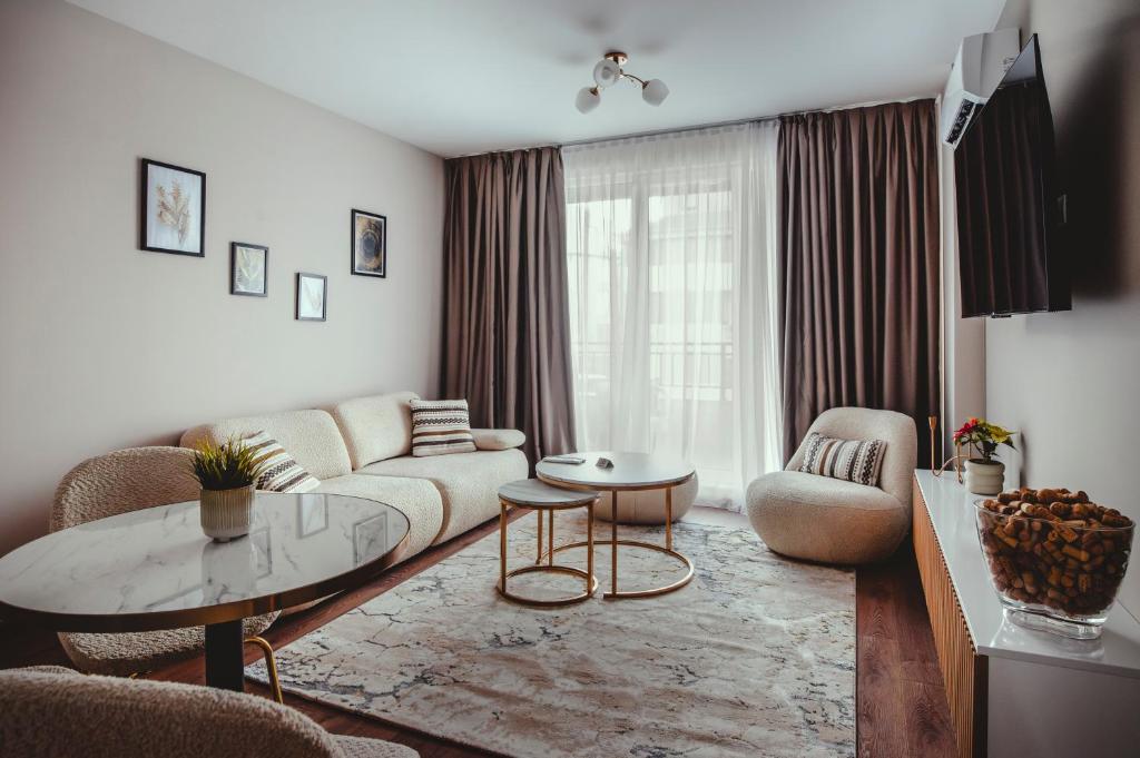 a living room with a couch and a table at Elegant Living Apartment 1 in Sofia