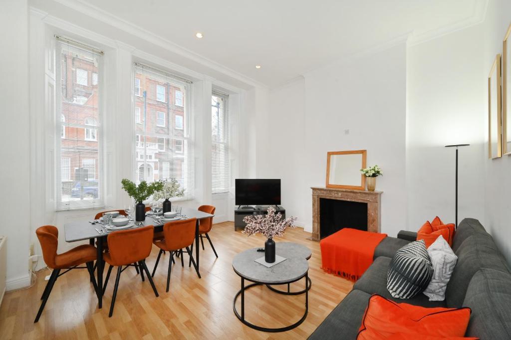 a living room with a couch and a table at London Choice Apartments - Gloucester Road - Kensington in London