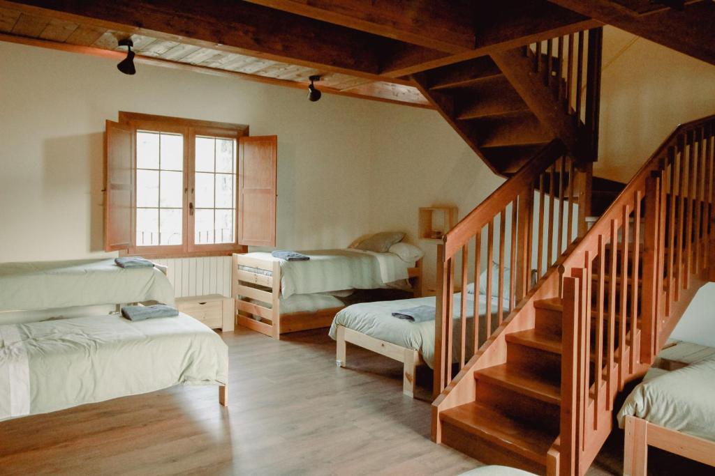 Katil atau katil-katil dalam bilik di Casa Rural Ger