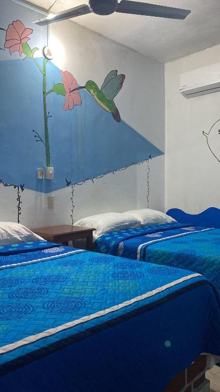 Postel nebo postele na pokoji v ubytování Hotel Lu'um