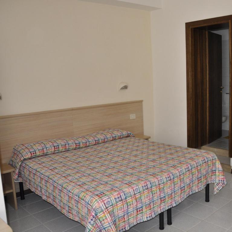 Postel nebo postele na pokoji v ubytování Hotel Fontanella