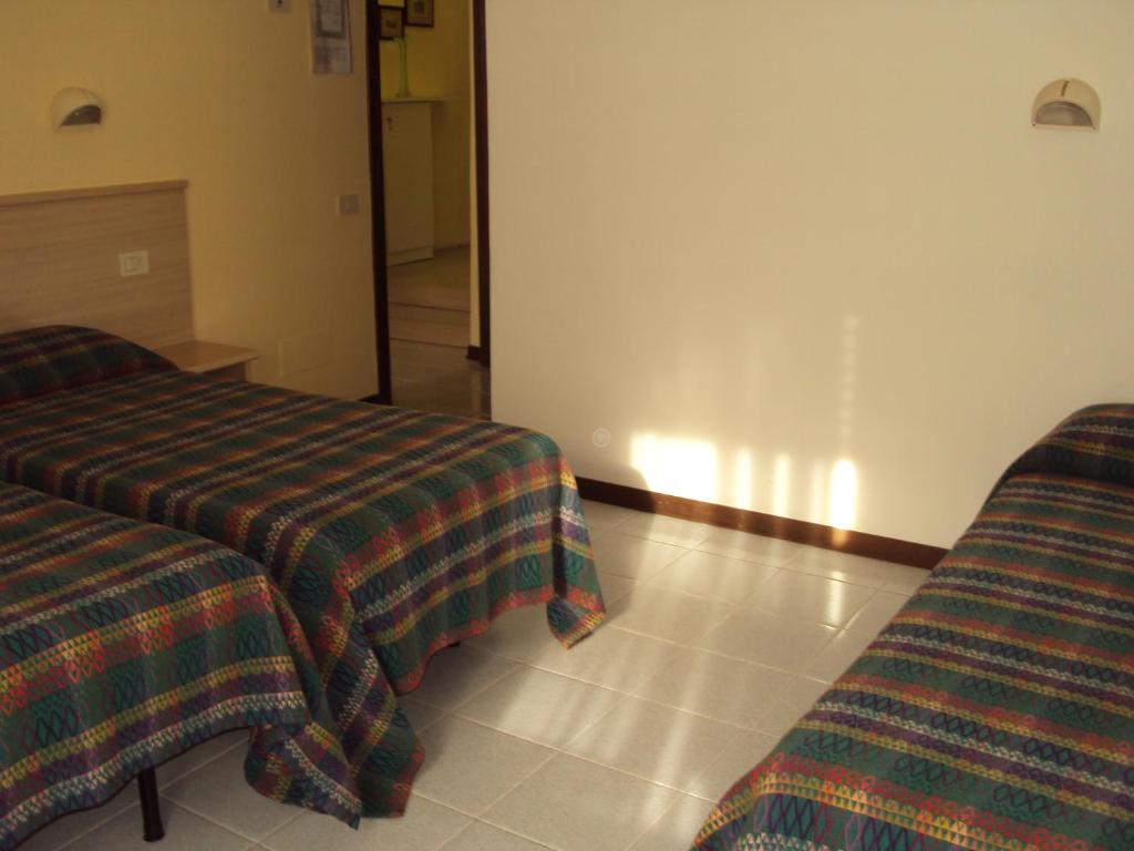 Postel nebo postele na pokoji v ubytování Hotel Fontanella