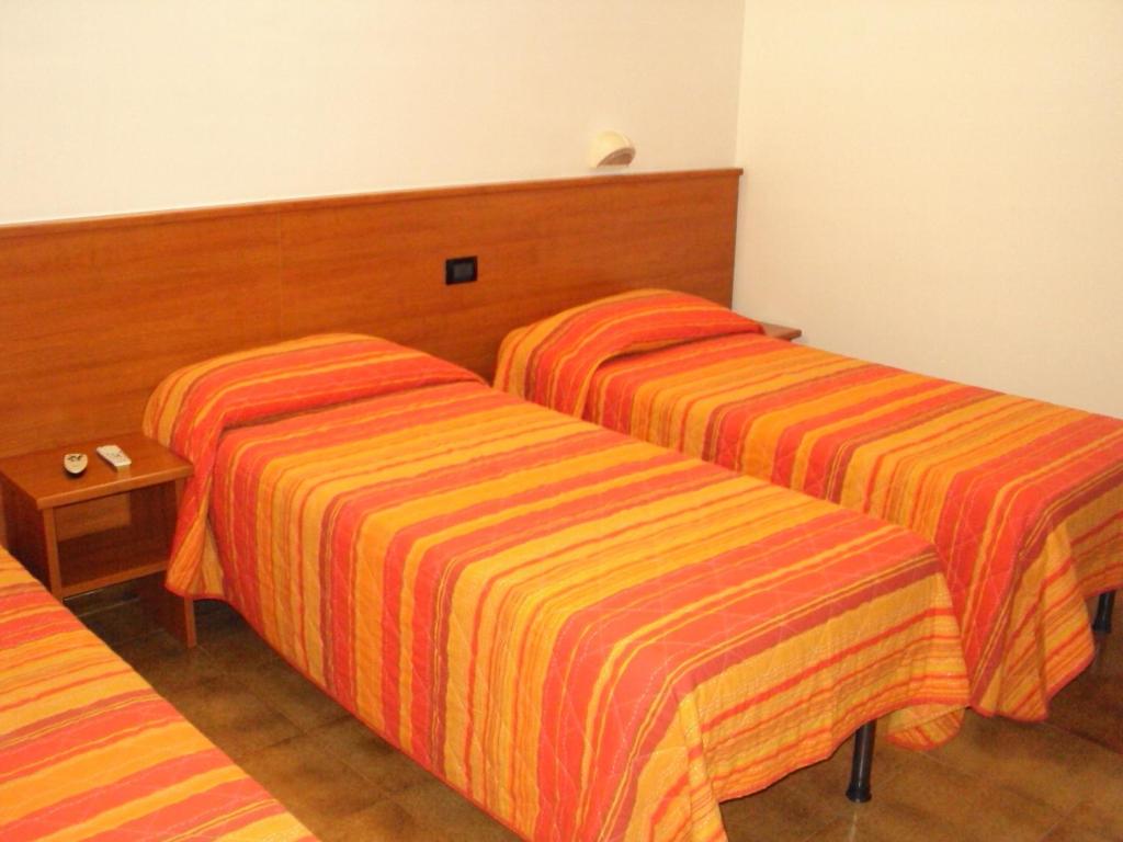Postel nebo postele na pokoji v ubytování Hotel Fontanella
