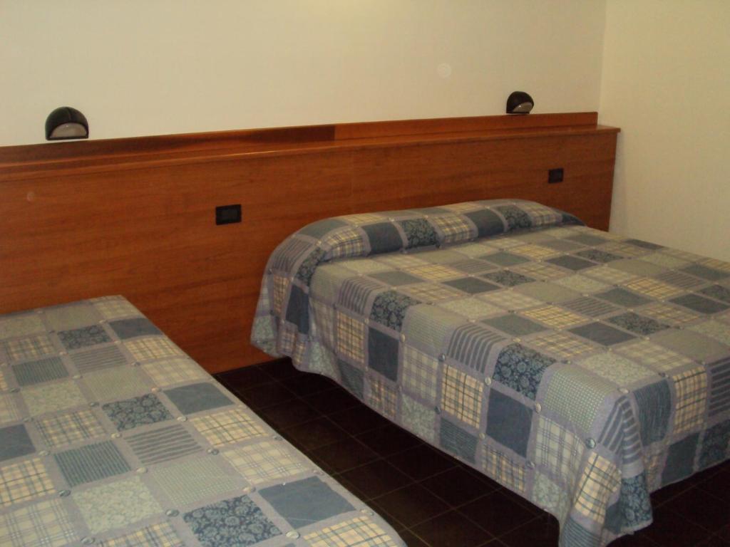 Postel nebo postele na pokoji v ubytování Hotel Fontanella