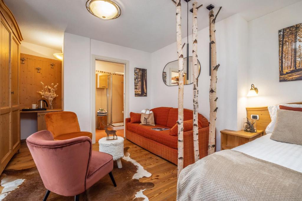 Postel nebo postele na pokoji v ubytování Hotel Folgarida