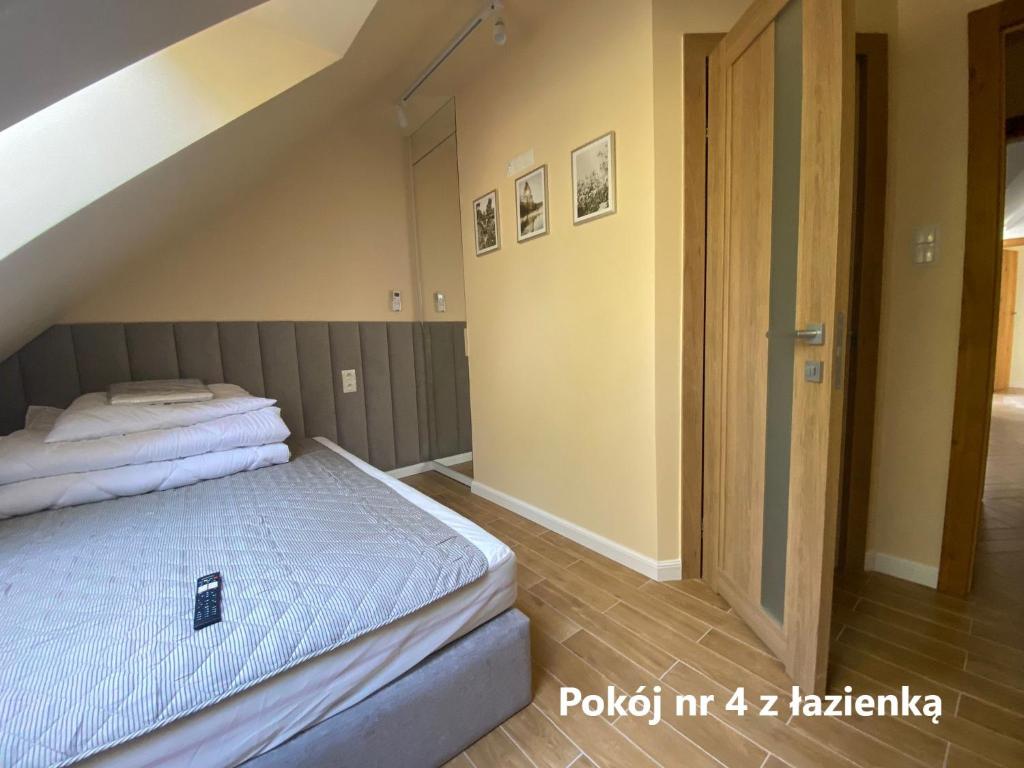 Postel nebo postele na pokoji v ubytování Zakątek Śniardwy