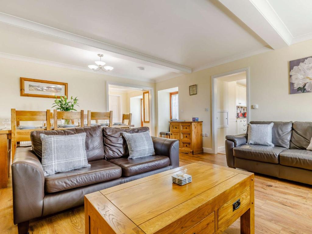 a living room with a couch and a coffee table at 3 bed in Bagillt 83813 in Bagillt