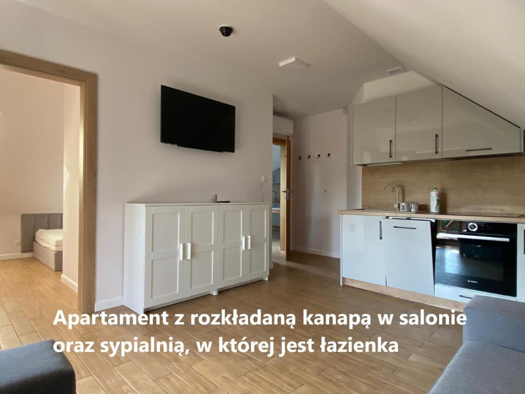 Kuchyň nebo kuchyňský kout v ubytování Zakątek Śniardwy