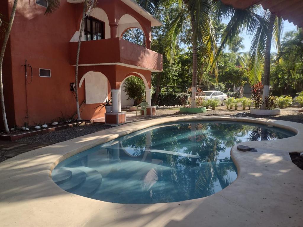 A piscina em ou perto de Santuario Iguanario