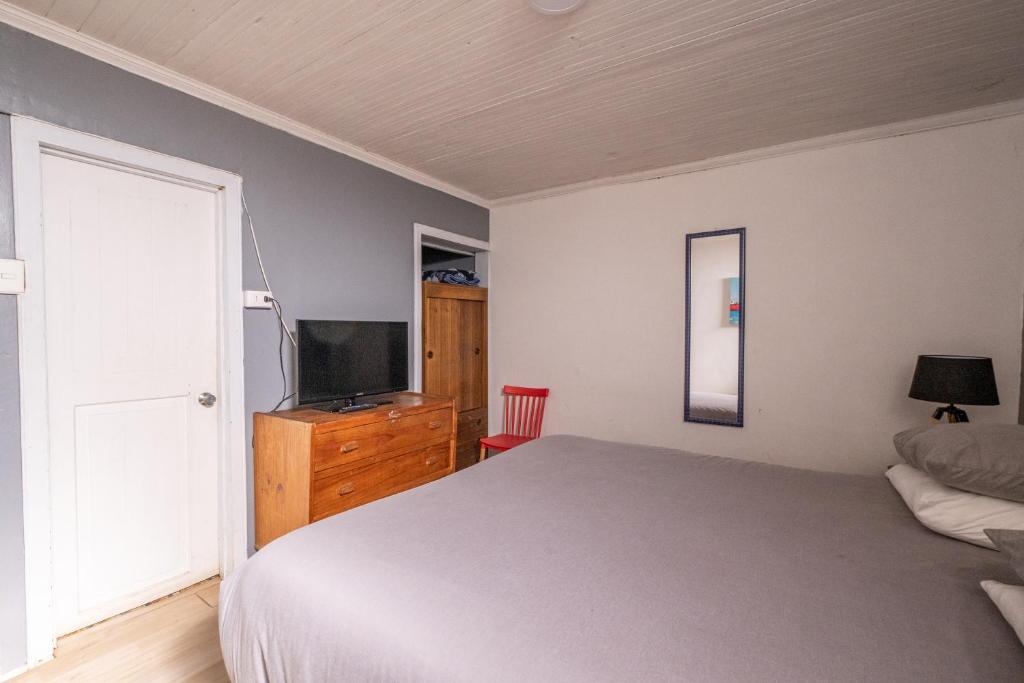 A bed or beds in a room at LÖF Hostal