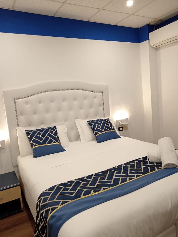 Postel nebo postele na pokoji v ubytování Hotel Veronese