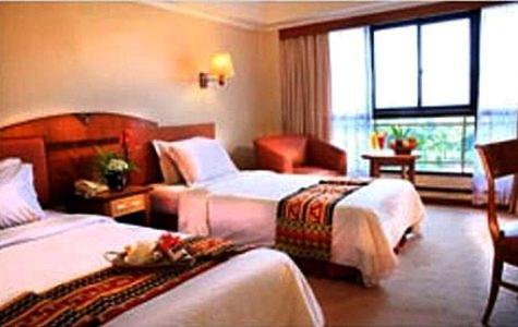 Postel nebo postele na pokoji v ubytování Hotel Sahid Bandar Lampung