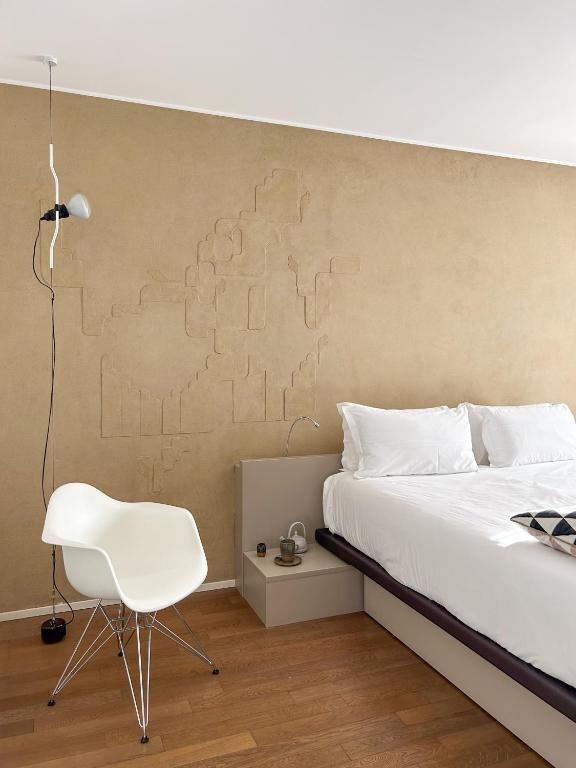 Postel nebo postele na pokoji v ubytování Le Nove Hotel
