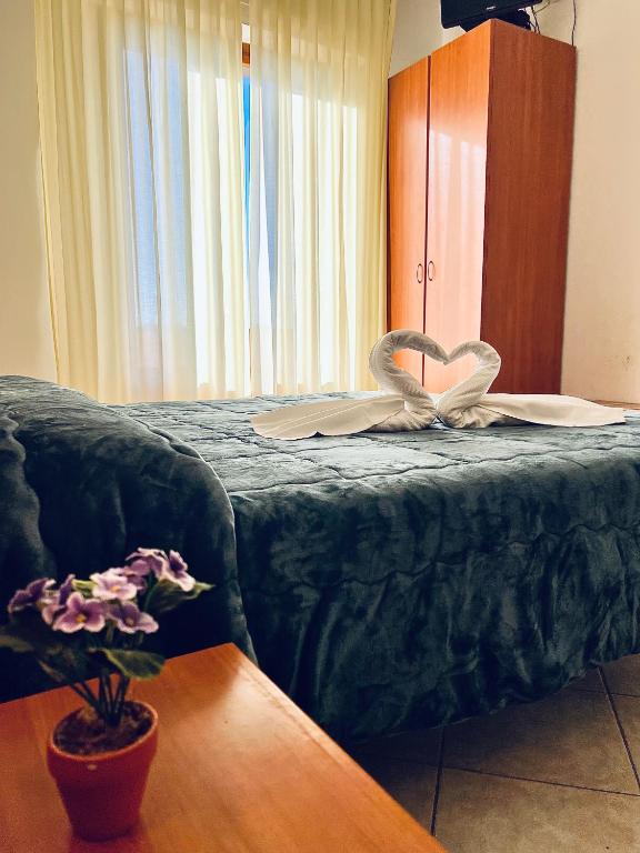 Postel nebo postele na pokoji v ubytování Hotel Vico Alto Siena