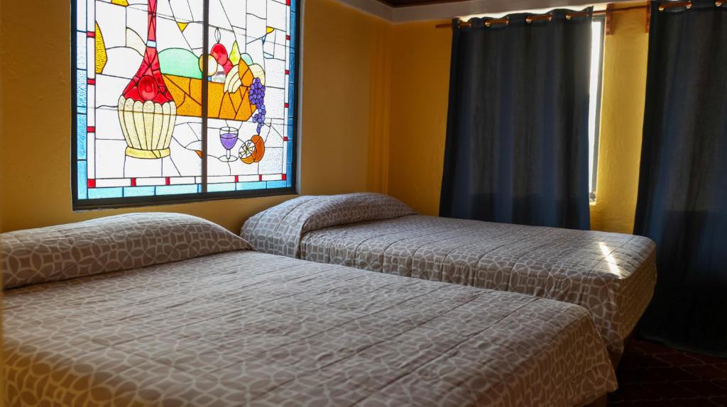 Postel nebo postele na pokoji v ubytování Posada La Mora - Hospedaje Panoramico