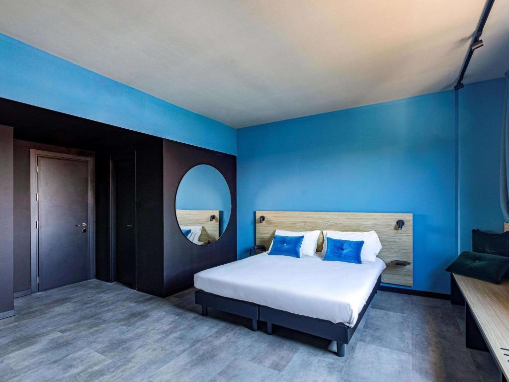 Postel nebo postele na pokoji v ubytování Ibis Styles Roma Aurelia