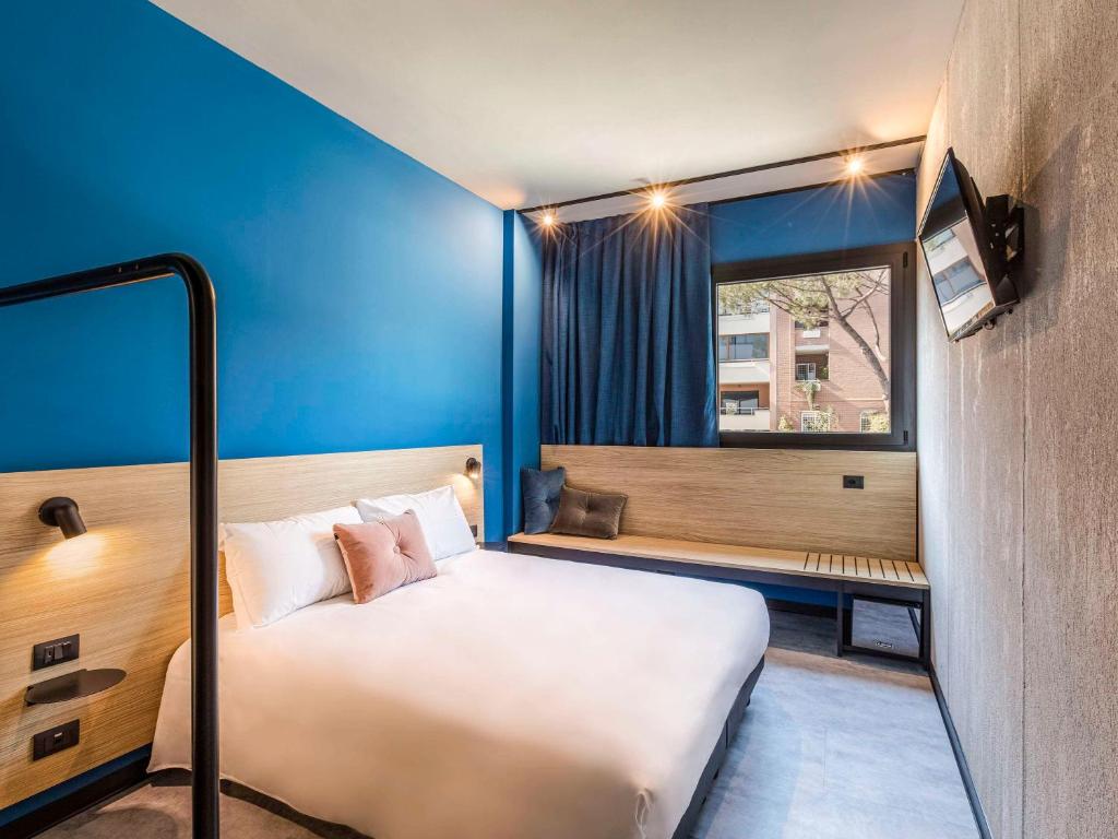 Postel nebo postele na pokoji v ubytování Ibis Styles Roma Aurelia