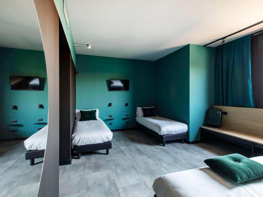 Postel nebo postele na pokoji v ubytování Ibis Styles Roma Aurelia