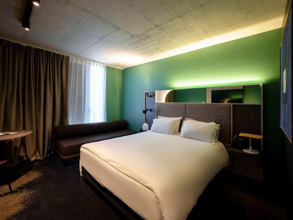 Postel nebo postele na pokoji v ubytování Mercure Hotel Delémont