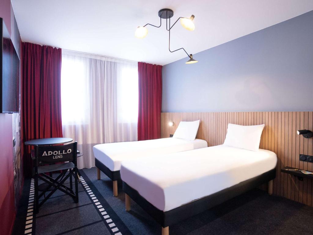 Postel nebo postele na pokoji v ubytování ibis Styles Lens Centre Gare