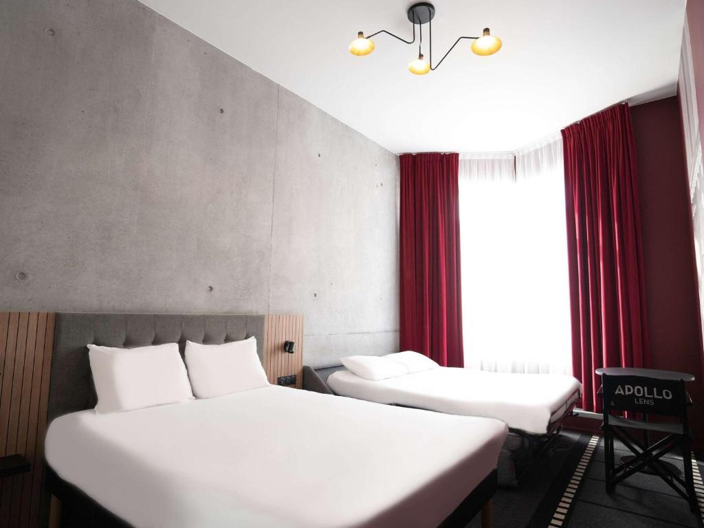 Postel nebo postele na pokoji v ubytování ibis Styles Lens Centre Gare