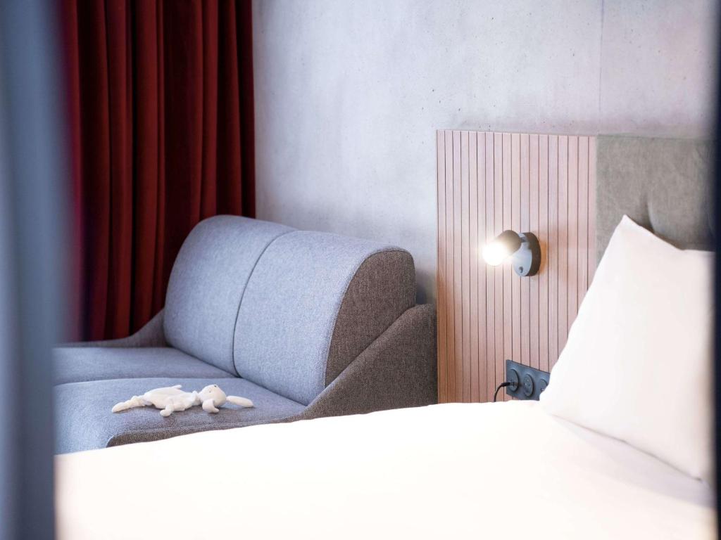 Postel nebo postele na pokoji v ubytování ibis Styles Lens Centre Gare