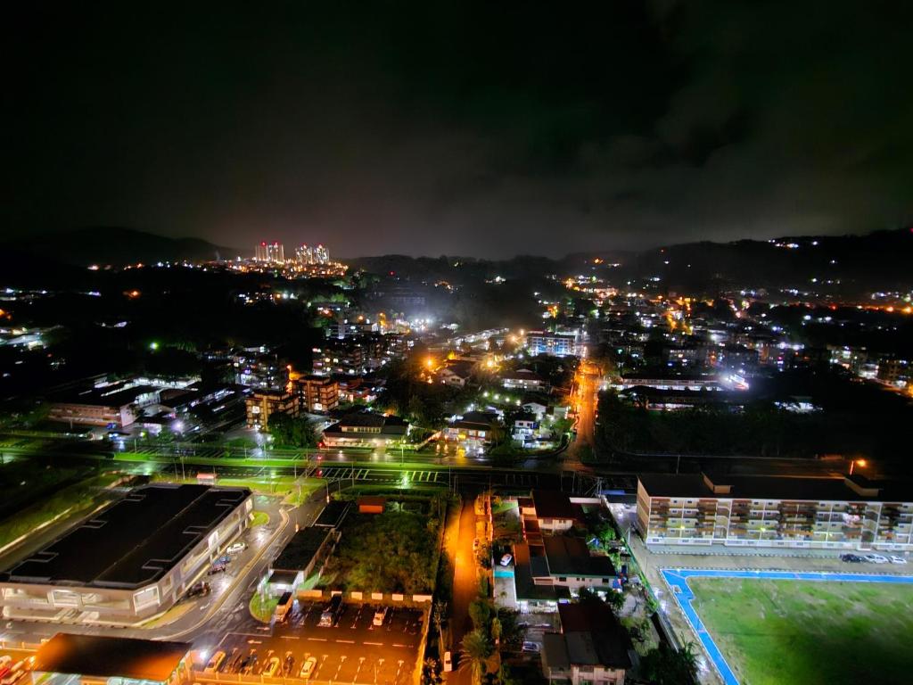 a view of a city at night with lights at Valerie Homestay in Sandakan