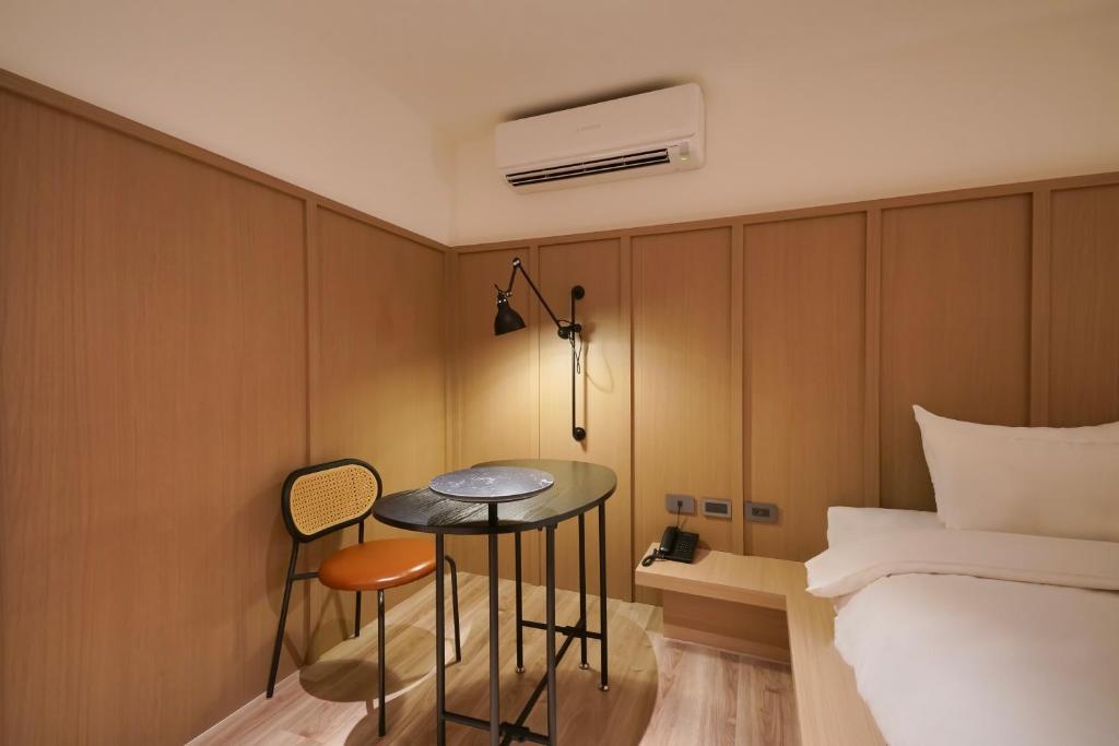 Postel nebo postele na pokoji v ubytování Hope Hotel Tainan