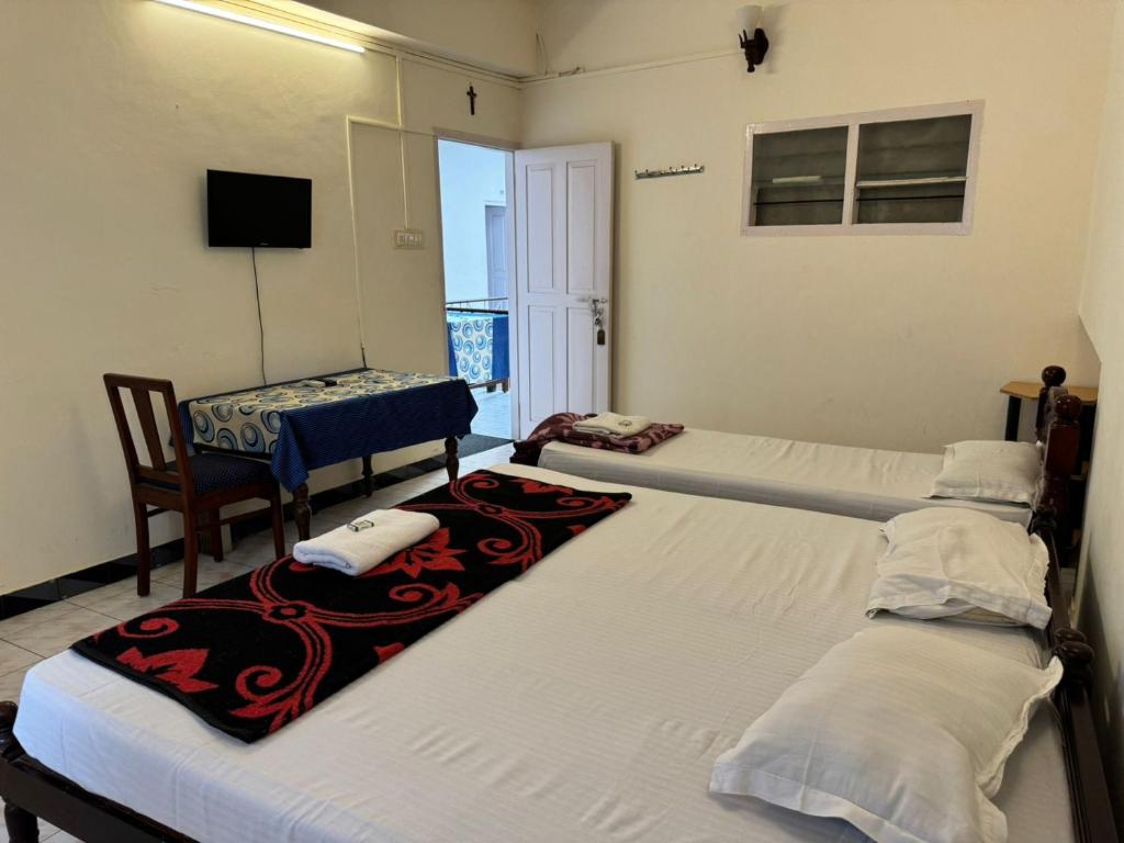 Postel nebo postele na pokoji v ubytování Aambal Residency