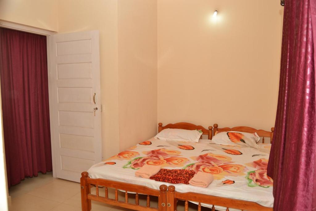 Postel nebo postele na pokoji v ubytování SHEEBA'S HOMESTAY