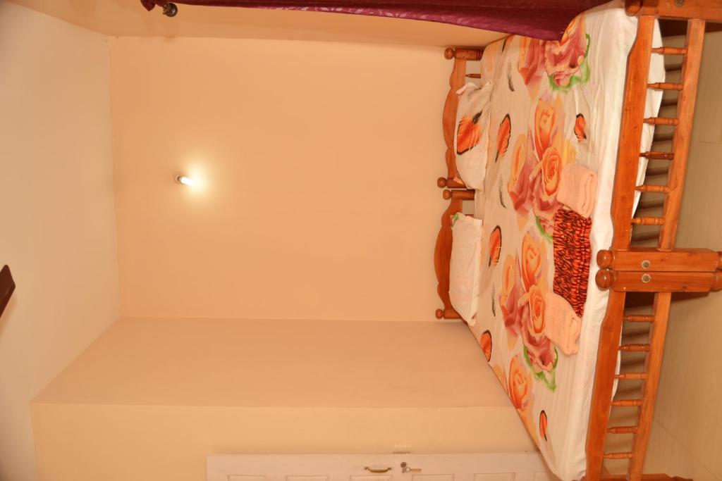 Postel nebo postele na pokoji v ubytování SHEEBA'S HOMESTAY
