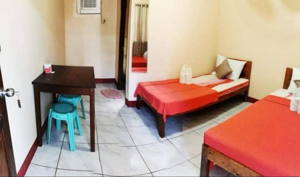 Postel nebo postele na pokoji v ubytování JBR Tourist Inn - Port Barton