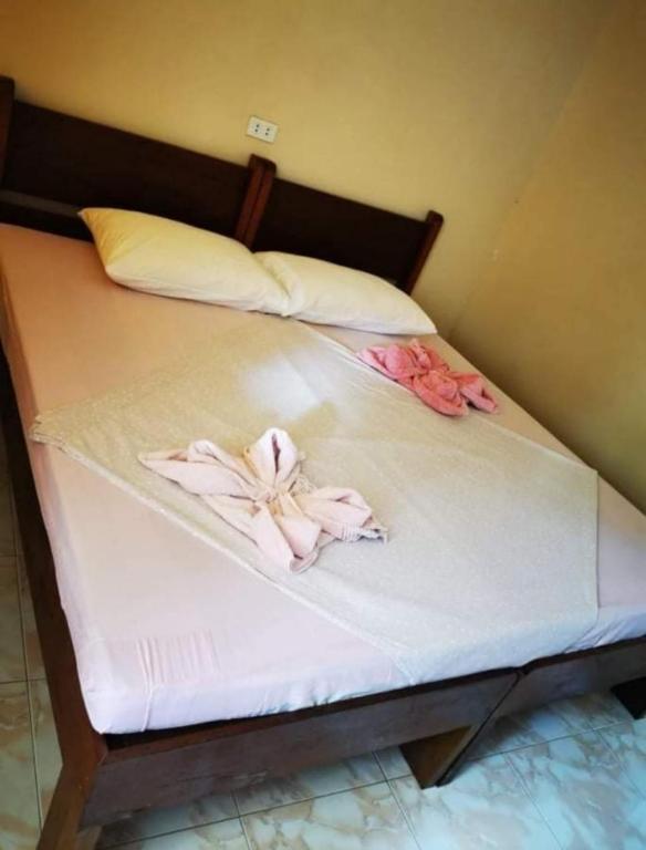 Postel nebo postele na pokoji v ubytování JBR Tourist Inn - Port Barton