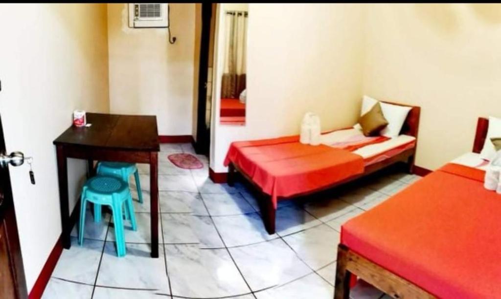 Postel nebo postele na pokoji v ubytování JBR Tourist Inn - Port Barton