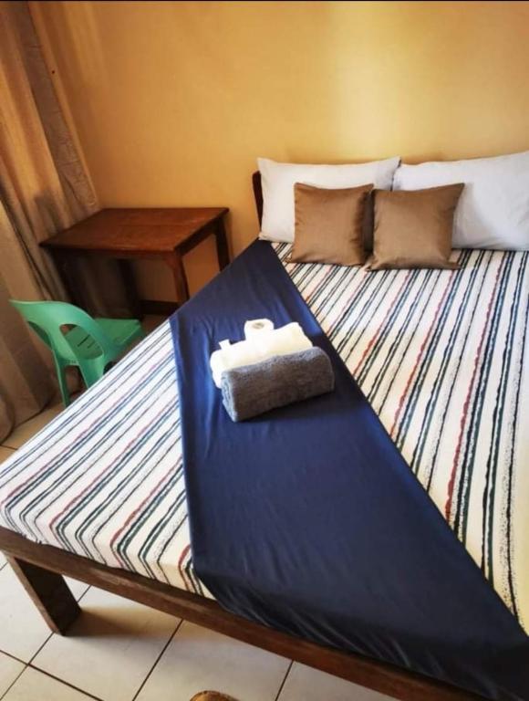 Postel nebo postele na pokoji v ubytování JBR Tourist Inn - Port Barton
