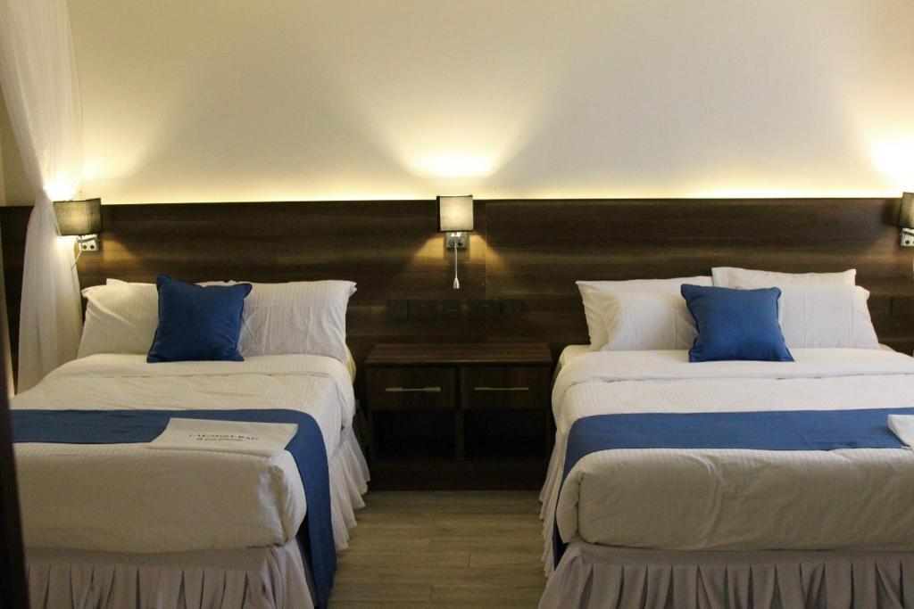 Postel nebo postele na pokoji v ubytování Lukenya Alkebu Resort